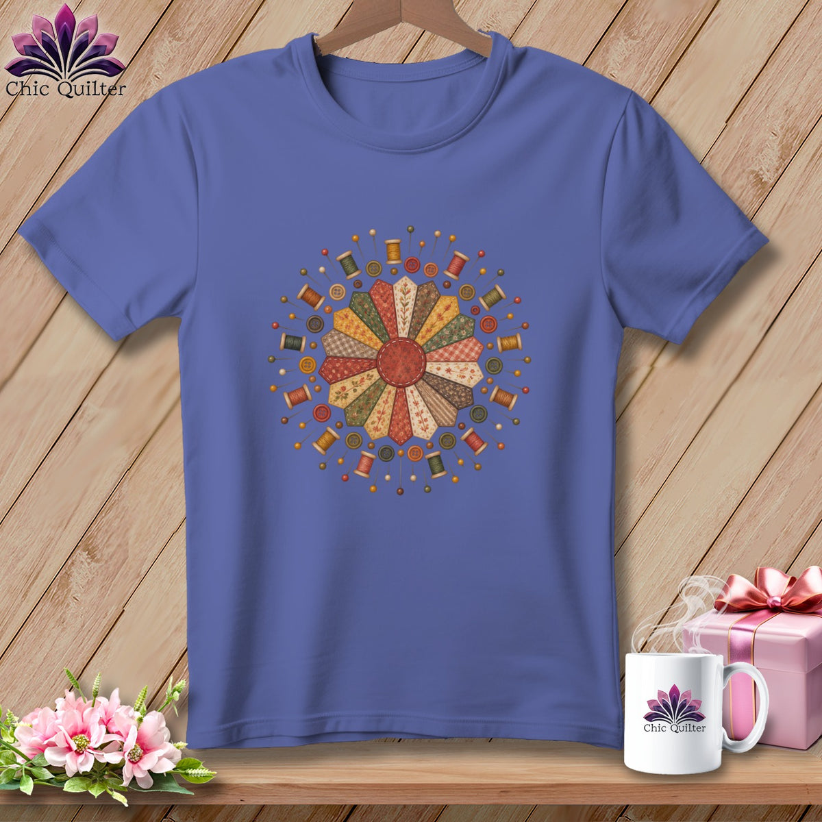 Purple t-shirt with a circular quilt block design and sewing notions.
