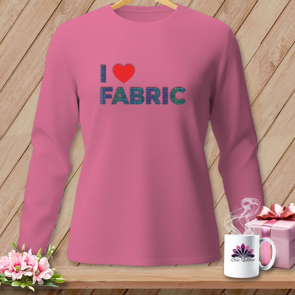 Pink long-sleeve shirt with "I ❤️ FABRIC" graphic and a Chic Quilter mug.