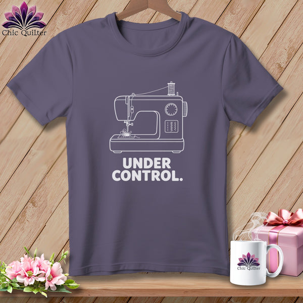 Purple t-shirt with a white outline of a sewing machine and "Under Control." text.