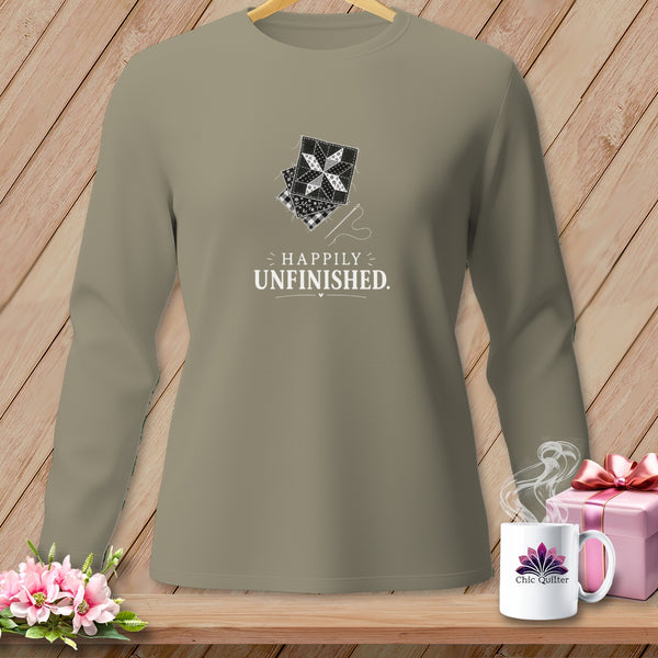 Long sleeve t-shirt with "Happily Unfinished" text and quilt block graphic.