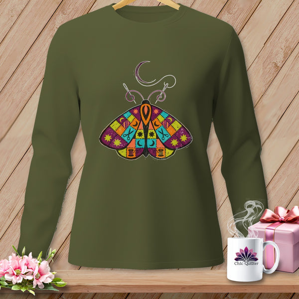 Olive green long sleeve shirt with a colorful patchwork moth graphic and crescent moon.