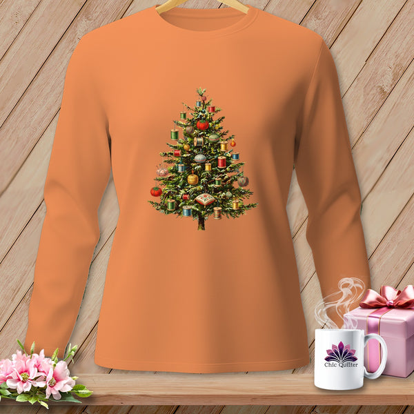 Orange long-sleeve shirt with a Christmas tree graphic adorned with spools of thread.