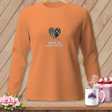 Orange long-sleeve shirt with a patchwork heart and text 