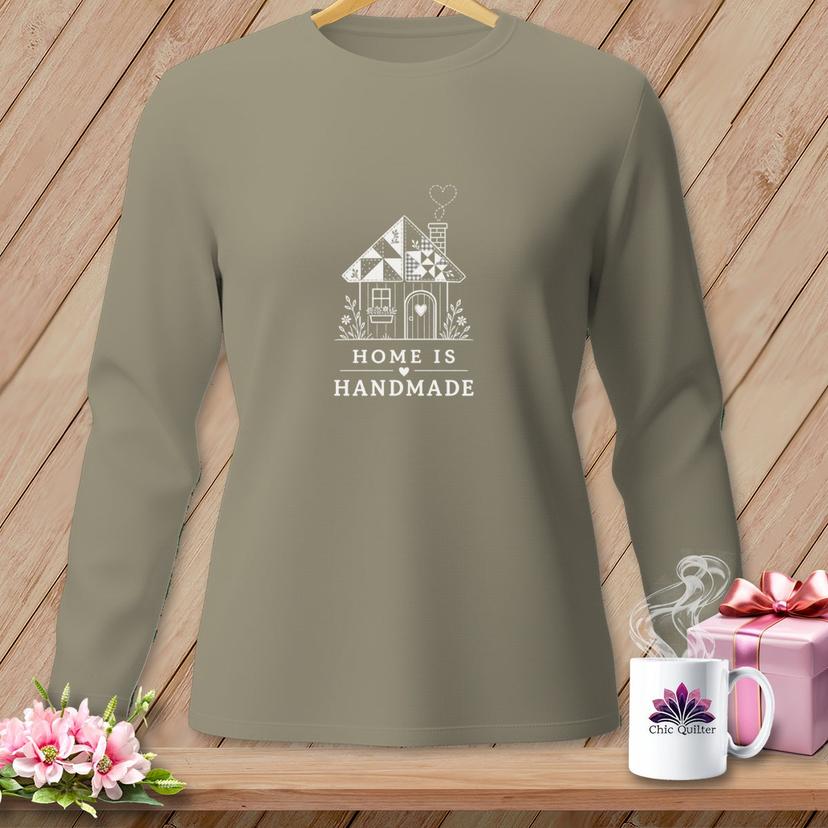 Taupe long-sleeve shirt with "Home Is Handmade" and quilt house graphic.