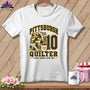 A white t-shirt features a graphic with the text Pittsburgh Quilter, a stack of quilts, a coffee mug, and the number 10.