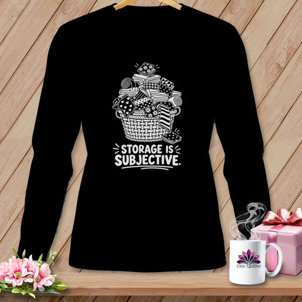 Black long-sleeve shirt with a basket of fabric and text "STORAGE IS SUBJECTIVE."