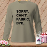 Tan long-sleeve shirt with black text 