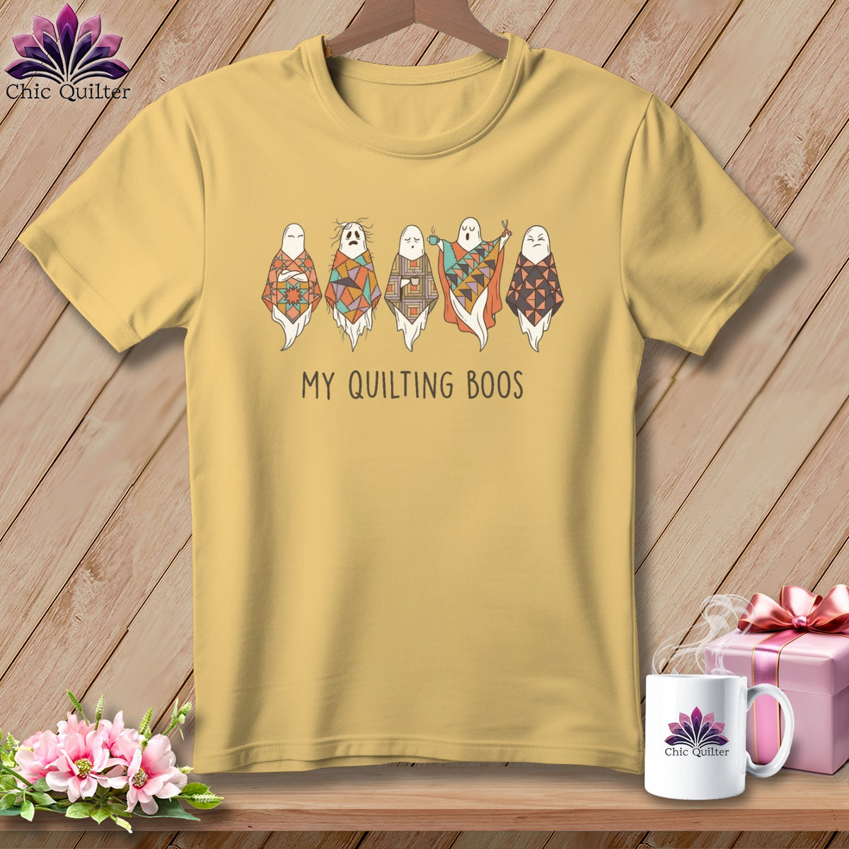 Yellow t-shirt with cartoon ghosts wearing patchwork quilts and the text "My Quilting Boos".