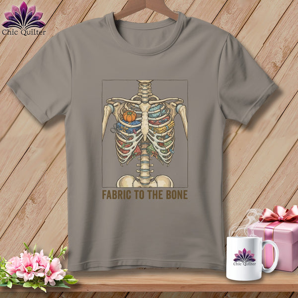 Skeleton filled with fabric, scissors, and pumpkins, text "FABRIC TO THE BONE".