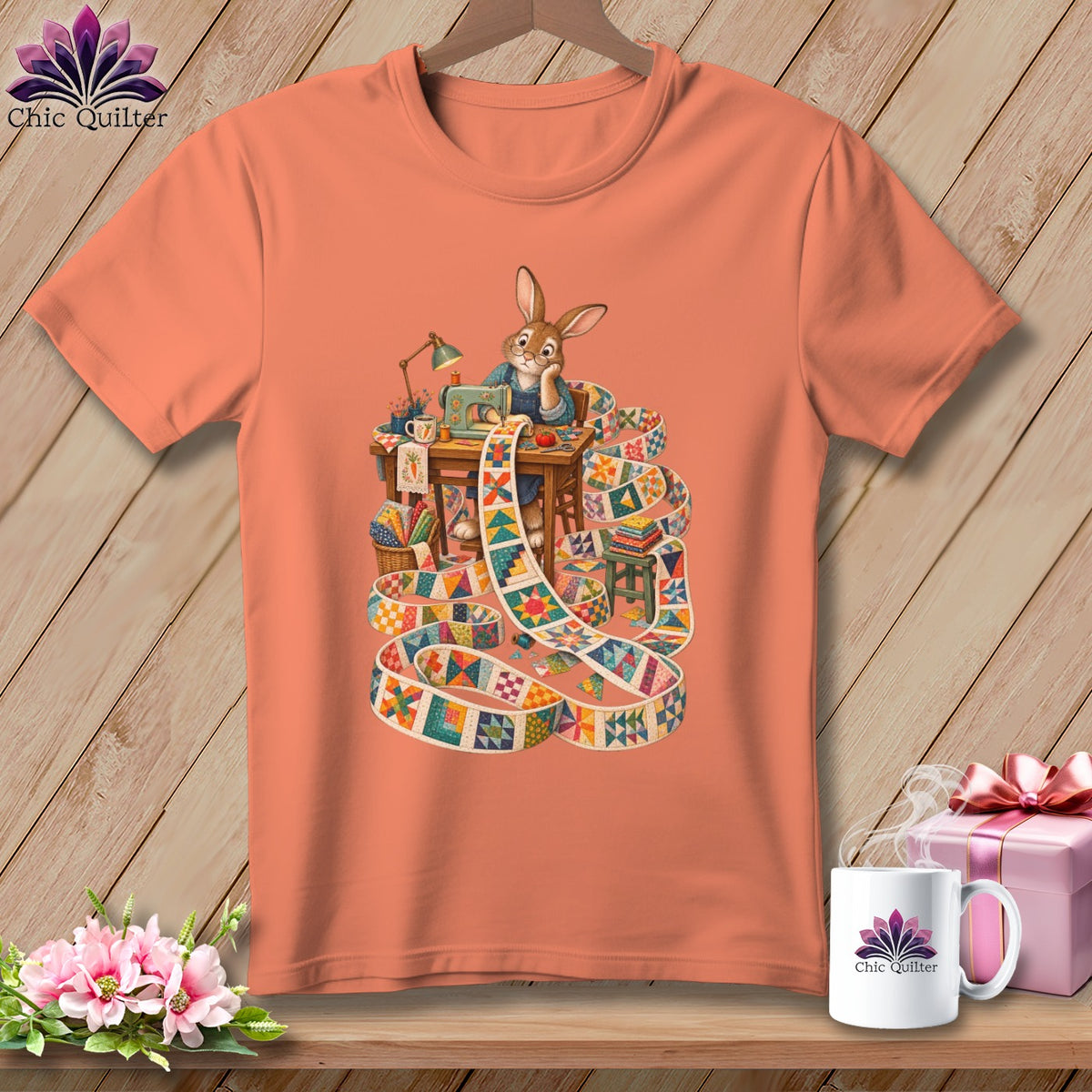 T-shirt with cartoon rabbit sewing a colorful quilt on an orange shirt.