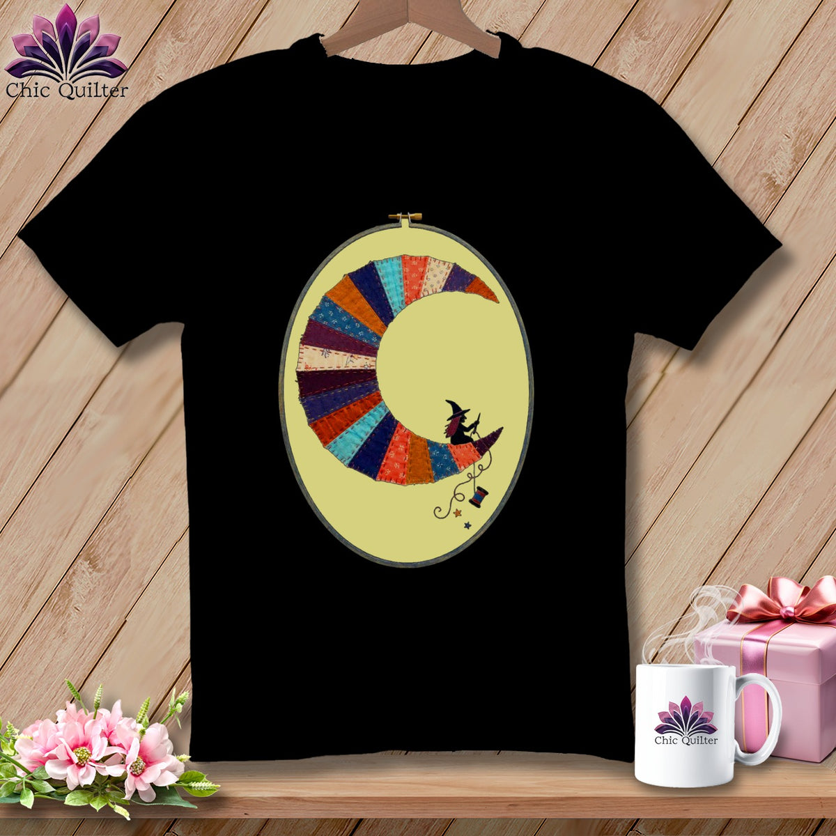Black t-shirt with a circular patchwork moon design featuring a witch silhouette.