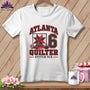 A white t-shirt features a red and black quilt-themed graphic with the text Atlanta Quilter Stitch Six.