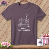 Purple t-shirt with a white line drawing of a sewing machine and text.