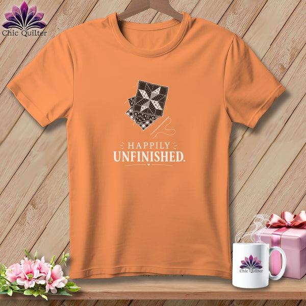 Orange t-shirt with patchwork squares and text "HAPPILY UNFINISHED."