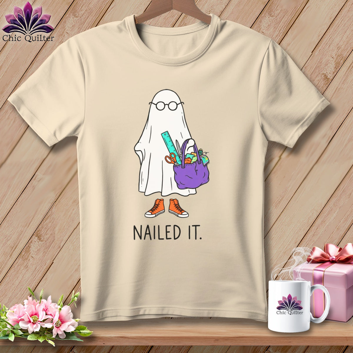Ghost with glasses carrying sewing supplies on t-shirt with "NAILED IT." text.