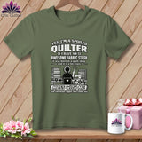 An olive green t-shirt with white text reading 