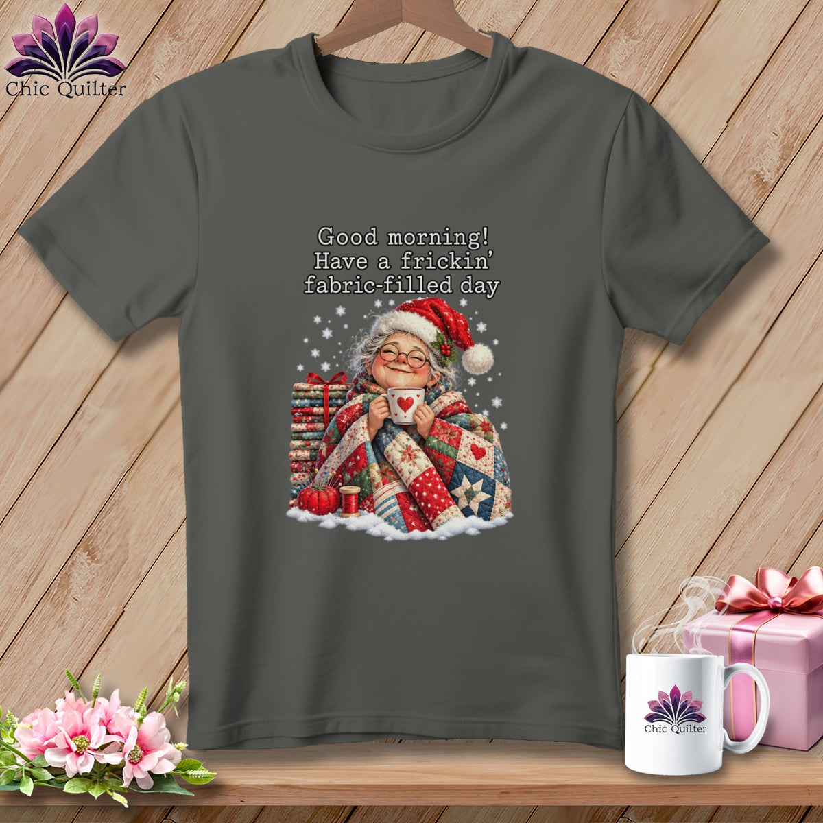 Dark gray t-shirt with a graphic of an elderly woman in a Santa hat holding a mug.