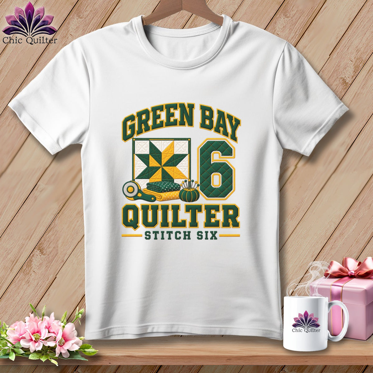 White t-shirt with green and yellow text reading Green Bay Quilter Stitch Six and a quilt graphic.