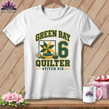 White t-shirt with green and yellow text reading Green Bay Quilter Stitch Six and a quilt graphic.