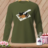Green long-sleeve shirt with graphic of black cat, hand, and sewing notions, text reads HELPING.