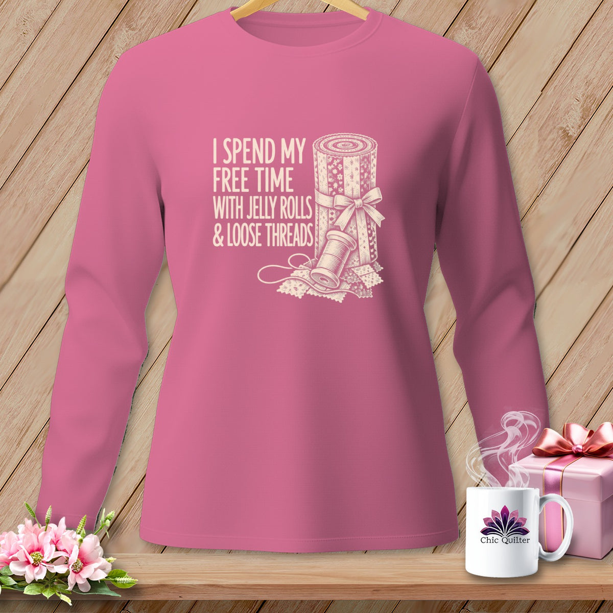 Pink long-sleeved shirt with "I Spend My Free Time With Jelly Rolls & Loose Threads" text.