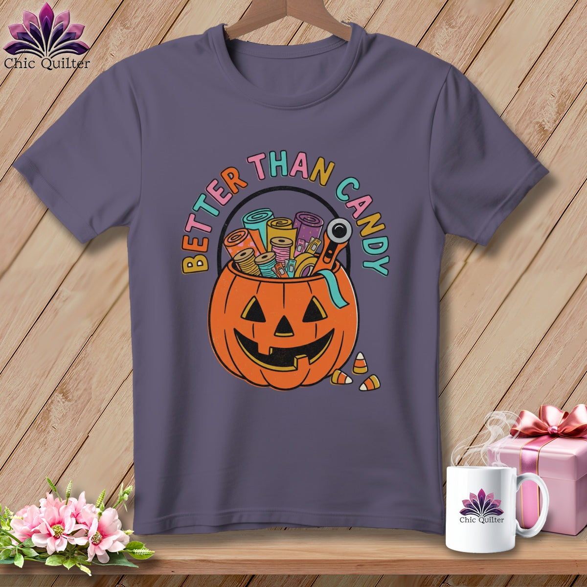 Purple t-shirt with pumpkin-shaped candy bucket filled with sewing supplies and "Better Than Candy" text.