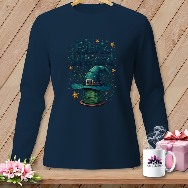 Dark blue long-sleeve shirt with "Fabric Wizard" text, green hat on spool of thread.