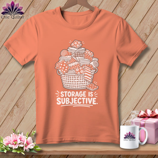 T-shirt with a basket of folded fabrics and the text "Storage is Subjective".