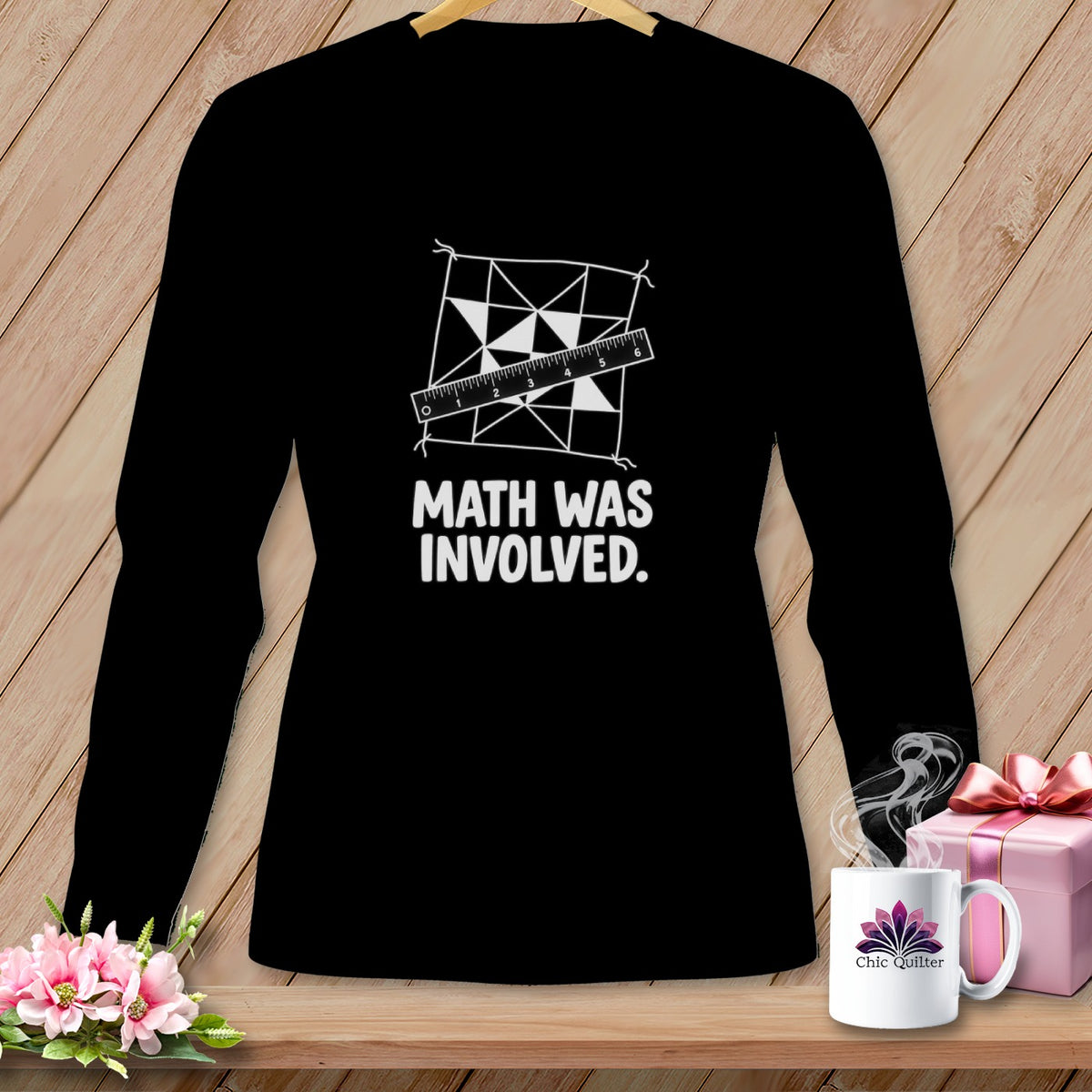 Black long-sleeve shirt with geometric pattern and ruler, saying "Math Was Involved."