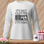 White long-sleeve shirt with "It's Not Clutter If It's Fabric" text and sewing icons.
