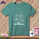 Teal t-shirt with white graphic of a sewing machine and text 
