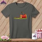 Charcoal gray crewneck t-shirt featuring a graphic of a woman riding a giant red spool of thread.