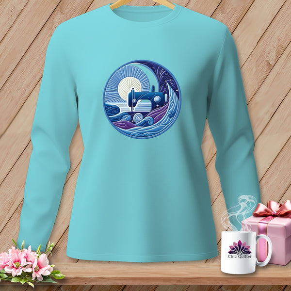 Turquoise long-sleeve shirt with a circular graphic of a sewing machine under a sun and waves.