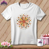 White t-shirt with a circular quilting design featuring spools of thread and buttons.