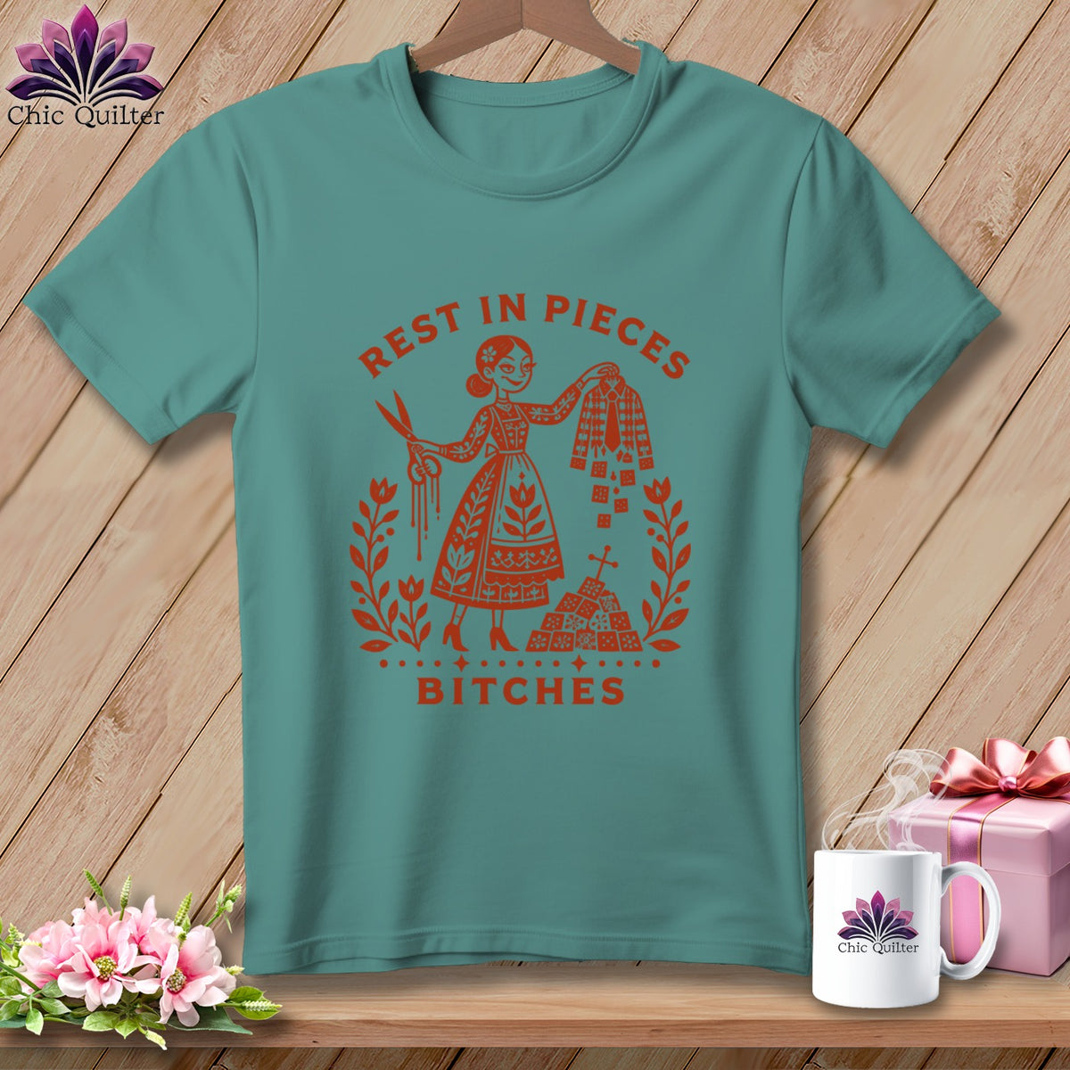 Teal t-shirt with "Rest in Pieces Bitches" graphic and scissors.