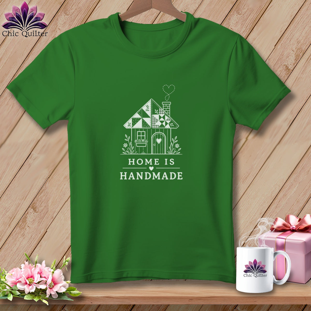 Green t-shirt with white graphic of a house and text "HOME IS HANDMADE".