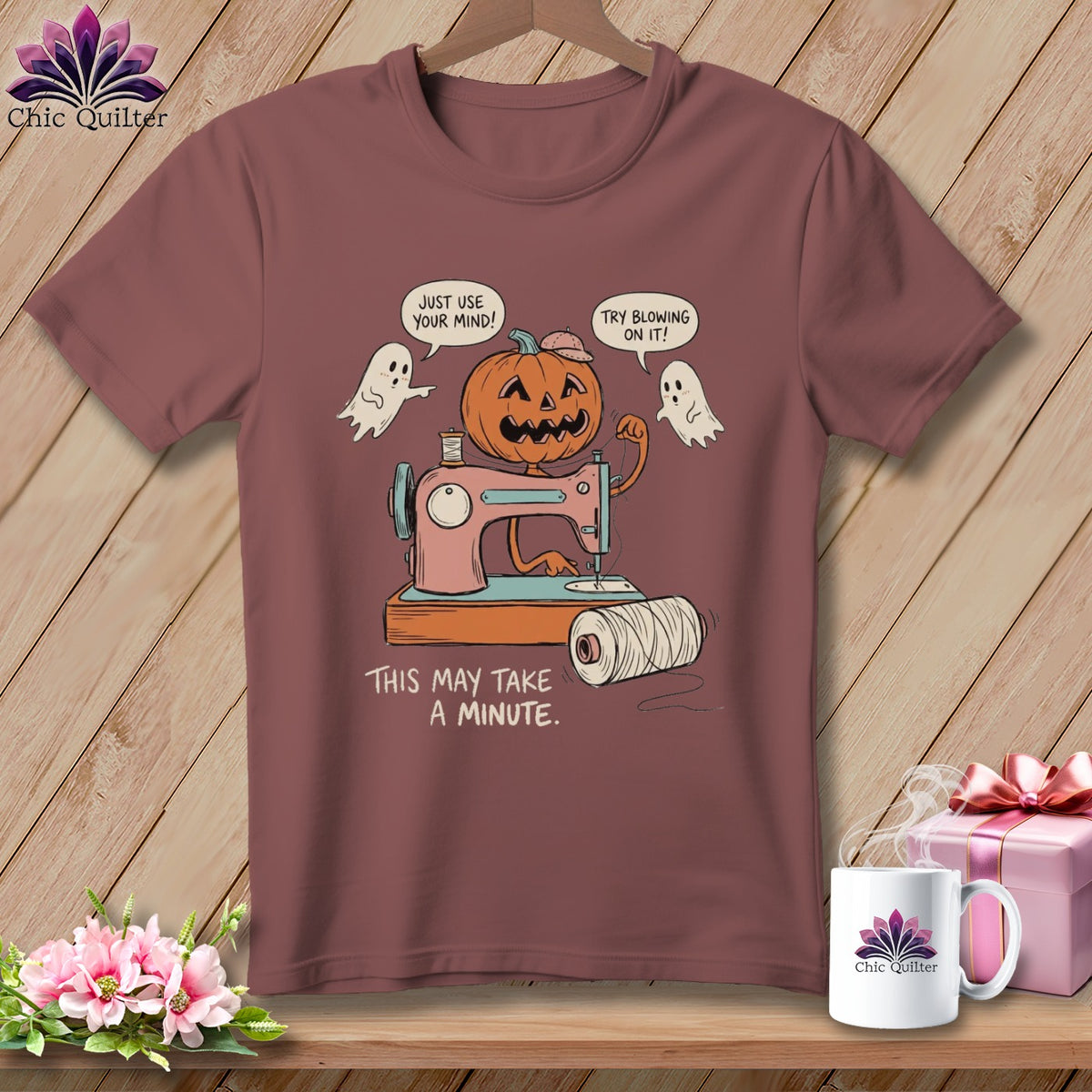 Halloween t-shirt with a pumpkin, ghosts, sewing machine, and text.
