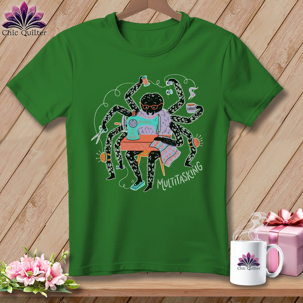Green t-shirt with a spider sewing and holding coffee, text reads "MULTITASKING".