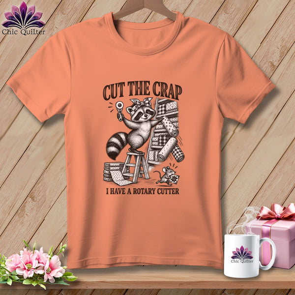 T-shirt with raccoon holding rotary cutter, text "CUT THE CRAP I HAVE A ROTARY CUTTER".