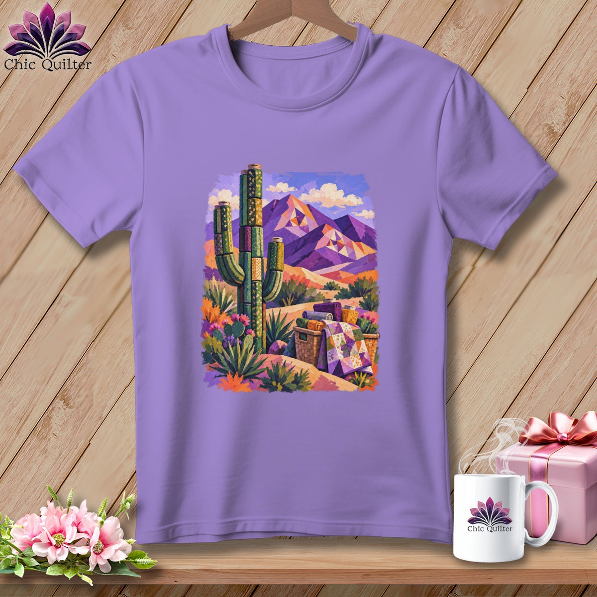 Purple crewneck t-shirt featuring a colorful painted desert scene with mountains, a saguaro cactus, and quilts.