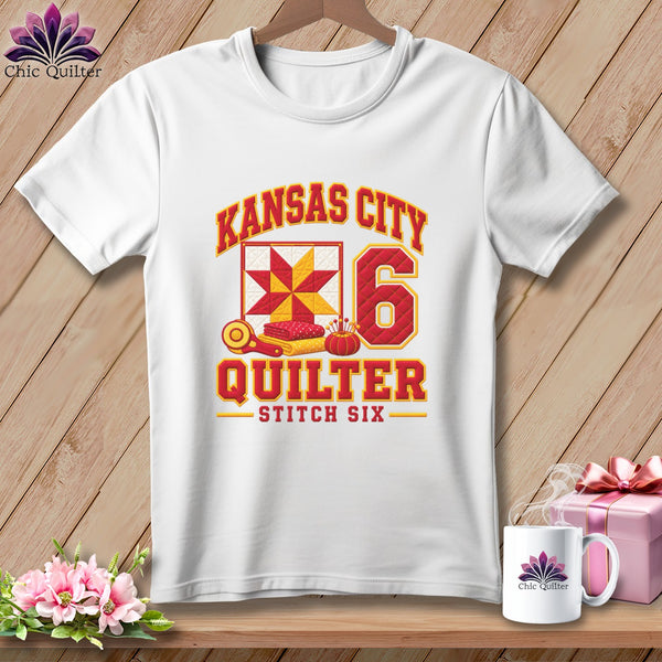 White t-shirt featuring a Kansas City Quilter design with a quilted star block and the number six.