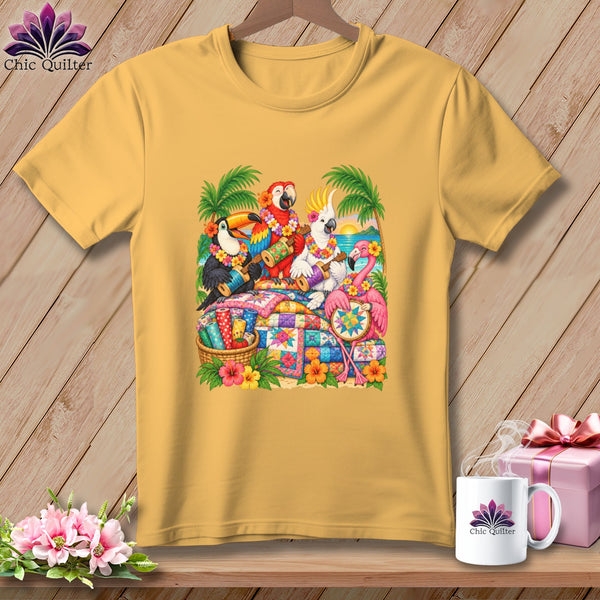 Mustard yellow t-shirt featuring a colorful graphic of tropical birds playing ukuleles over stacked quilts.