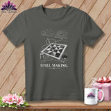 Dark gray t-shirt with a quilt, needle, thread, and scissors, and text 