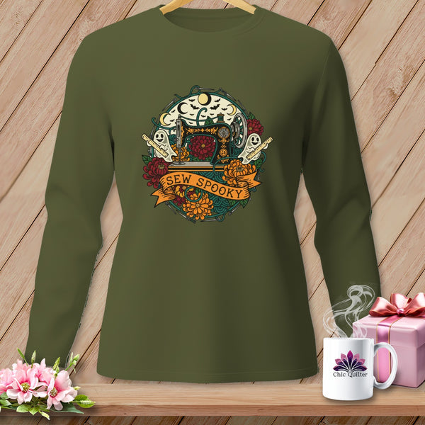 Olive green long-sleeve shirt with circular Halloween sewing design and "Sew Spooky" text.