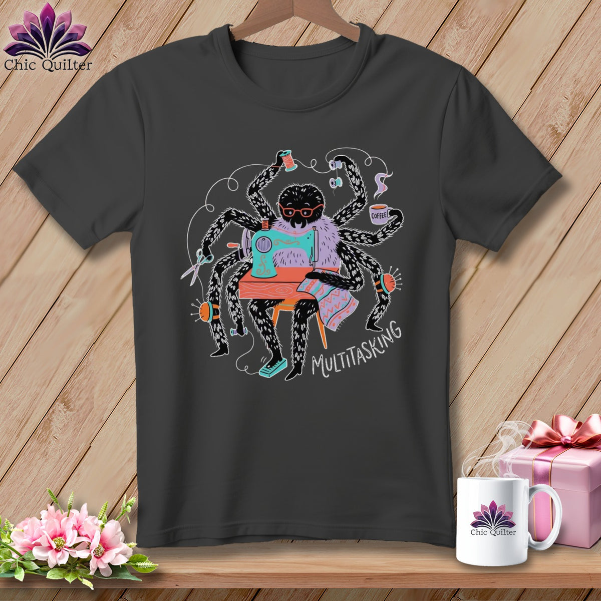 Spider wearing glasses sewing and holding coffee, text says "MULTITASKING".