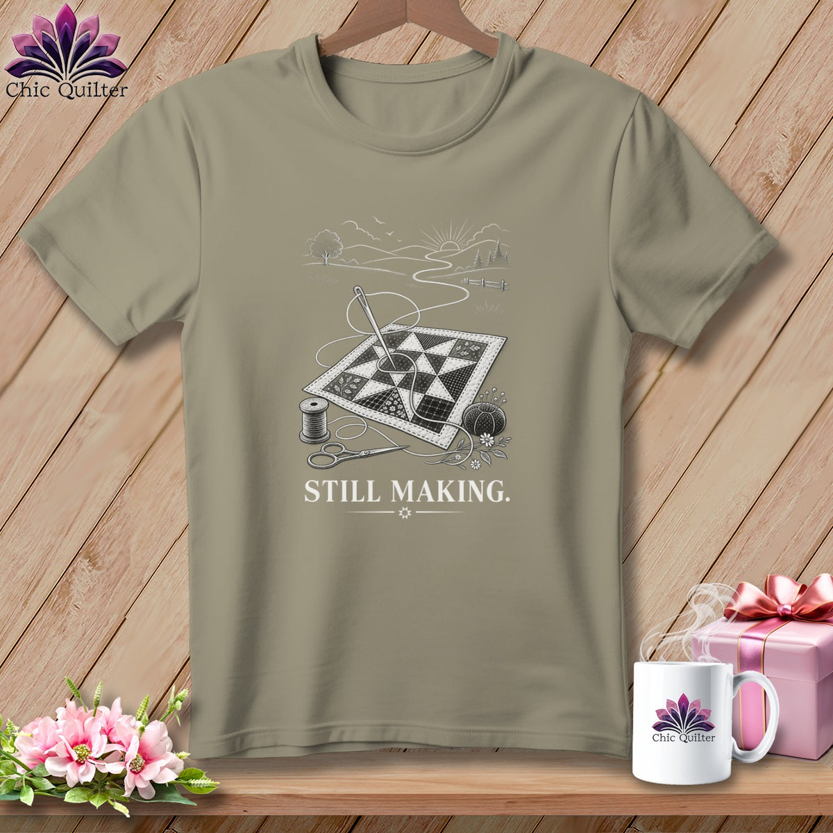 T-shirt with a quilt, sewing needle, thread, scissors, and the text "STILL MAKING."