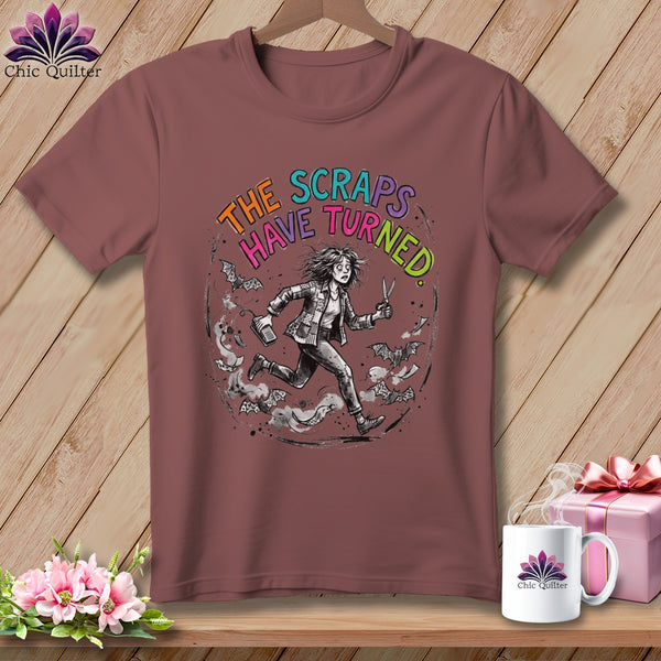 T-shirt with "The Scraps Have Turned" text and a running figure with scissors and bats.