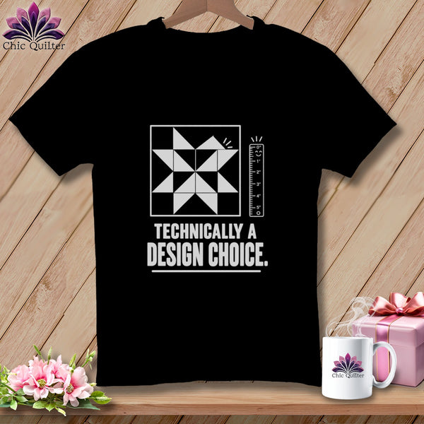Black t-shirt with quilt block graphic and text "Technically a design choice."