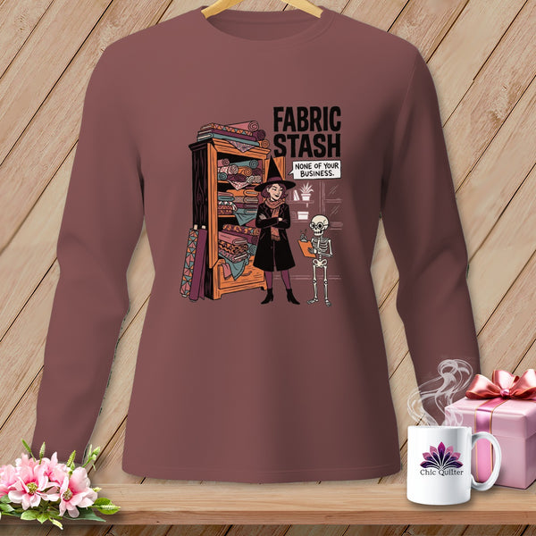 T-shirt graphic with witch and skeleton next to fabric stash, reads "FABRIC STASH. NONE OF YOUR BUSINESS."