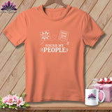 Peach t-shirt with white quilting designs and text 